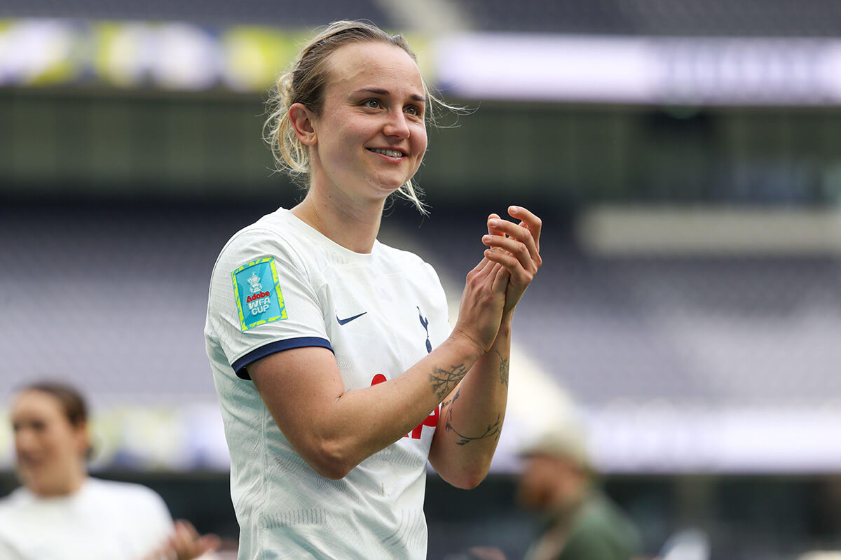 Image showing a Tottenham player clapping while wearing a Women's FA Cup badge