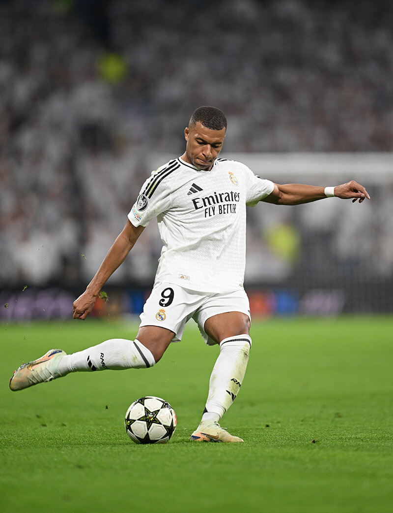 Image showing Killian Mbappe in action with a UCL 15 times winner badge on his sleeve