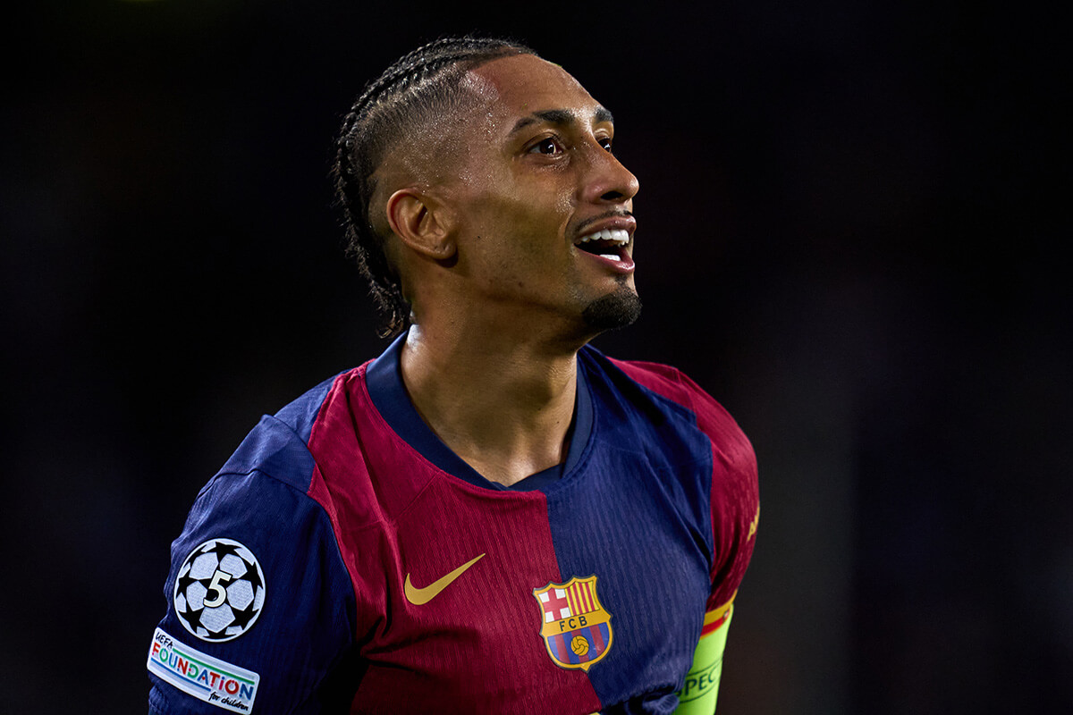 Image showing Raphina smiling with a 5 times winner UCL badge on his sleeve