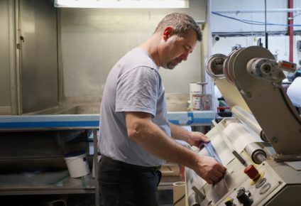 Image showing an ID UNLIMITED worker on the manufacturing line for club fonts