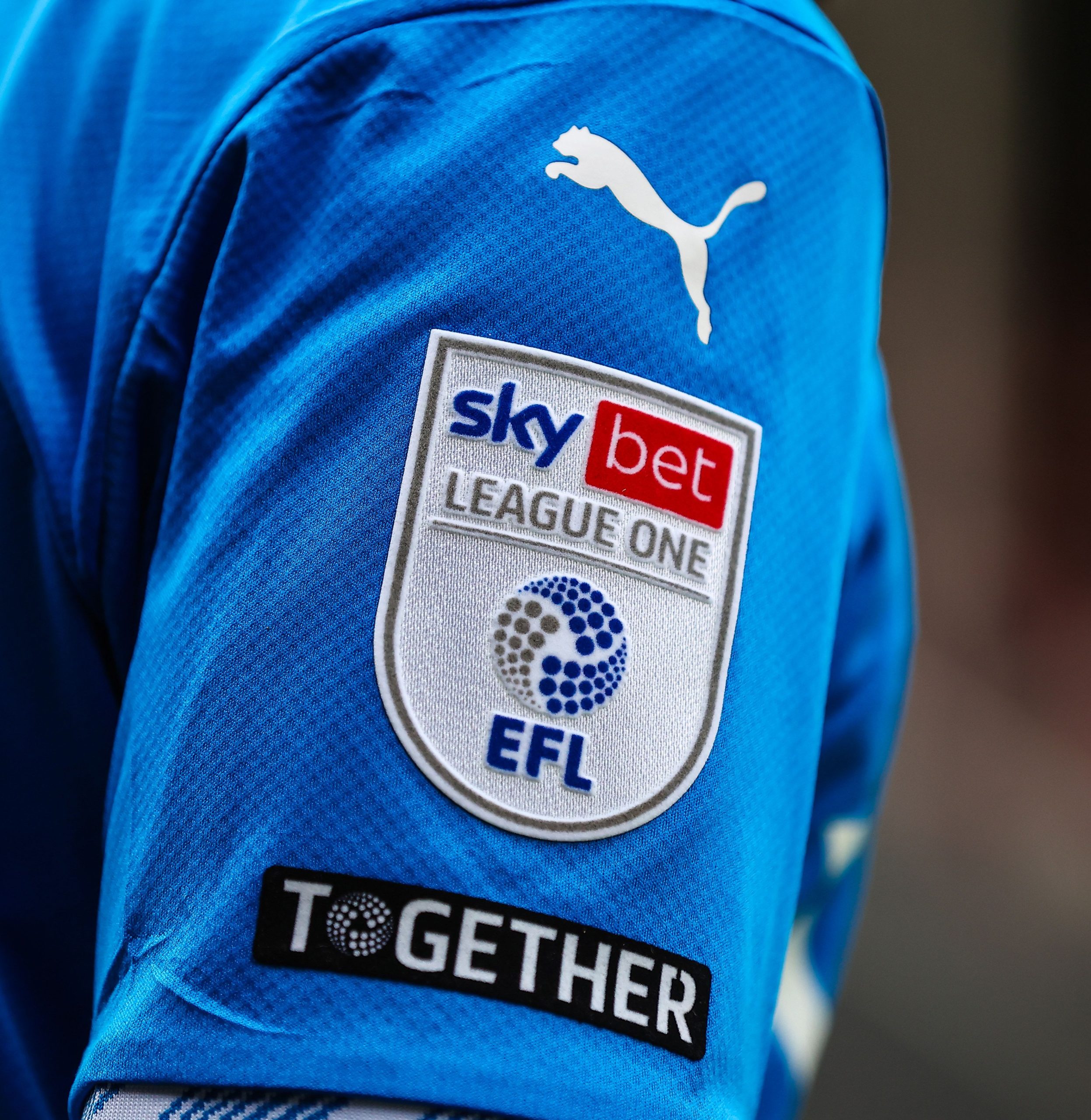 Image showing the Sky Bet League One sleeve patch and EFL Together patch on a player sleeve