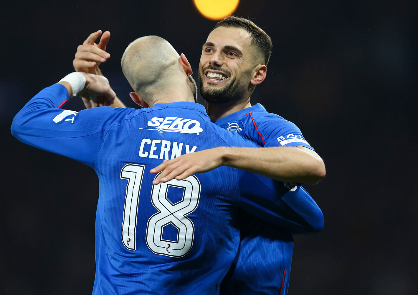 Image showing two Rangers players celebrating while wearing the official SPFL font